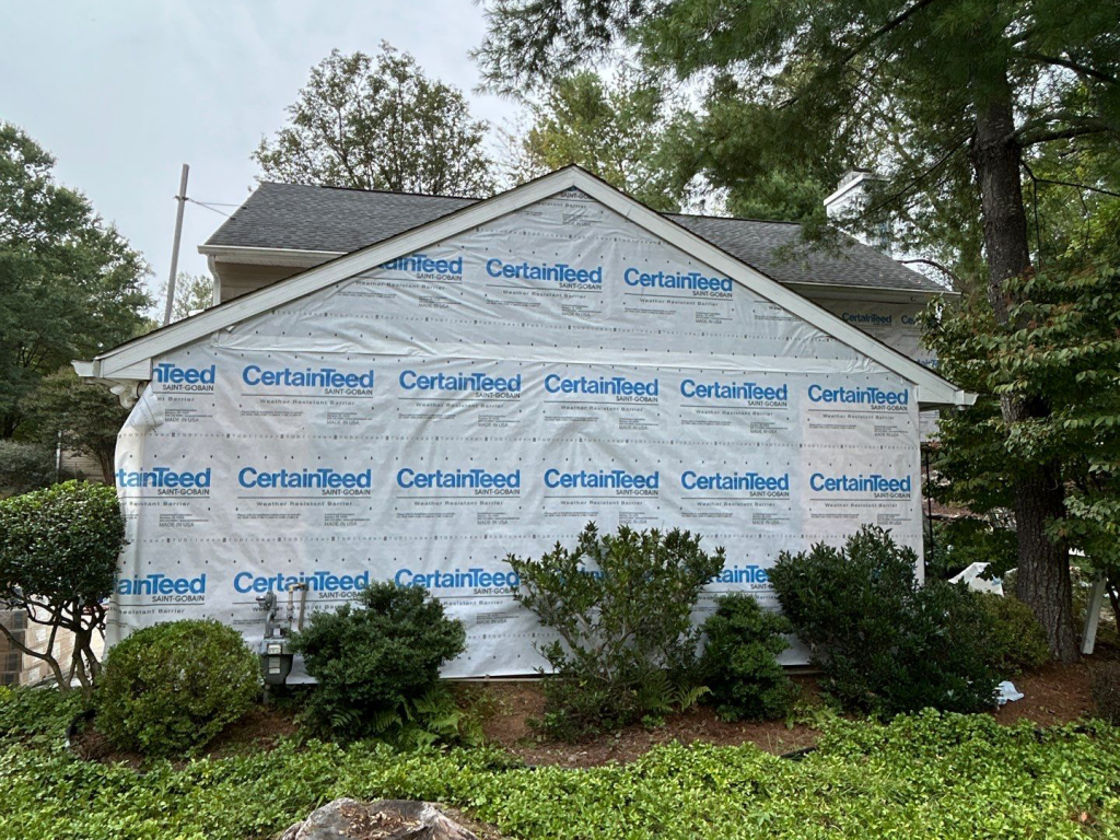 House under renovation with CertainTeed weather barrier wrap