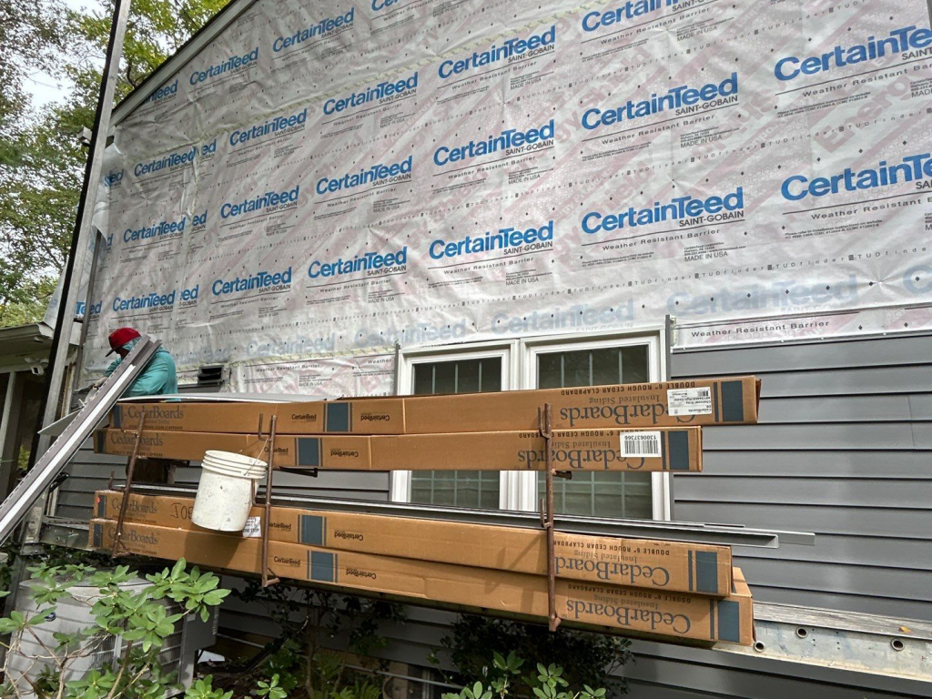 House siding installation in progress with CertainTeed material