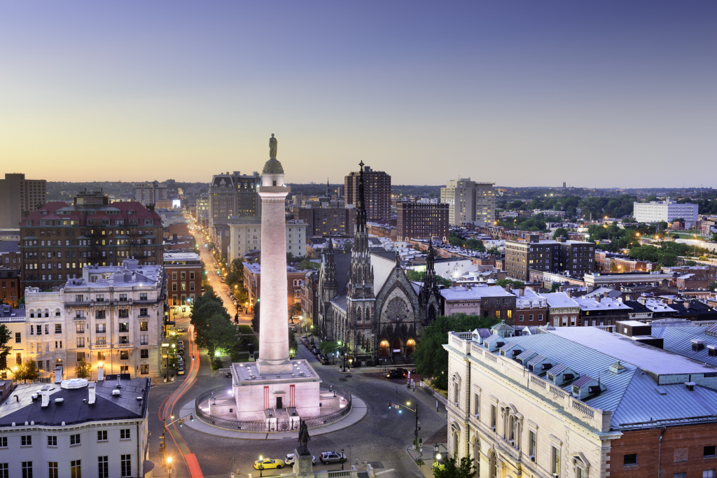 Sunset view of Baltimore cityscape with Washington Monument.