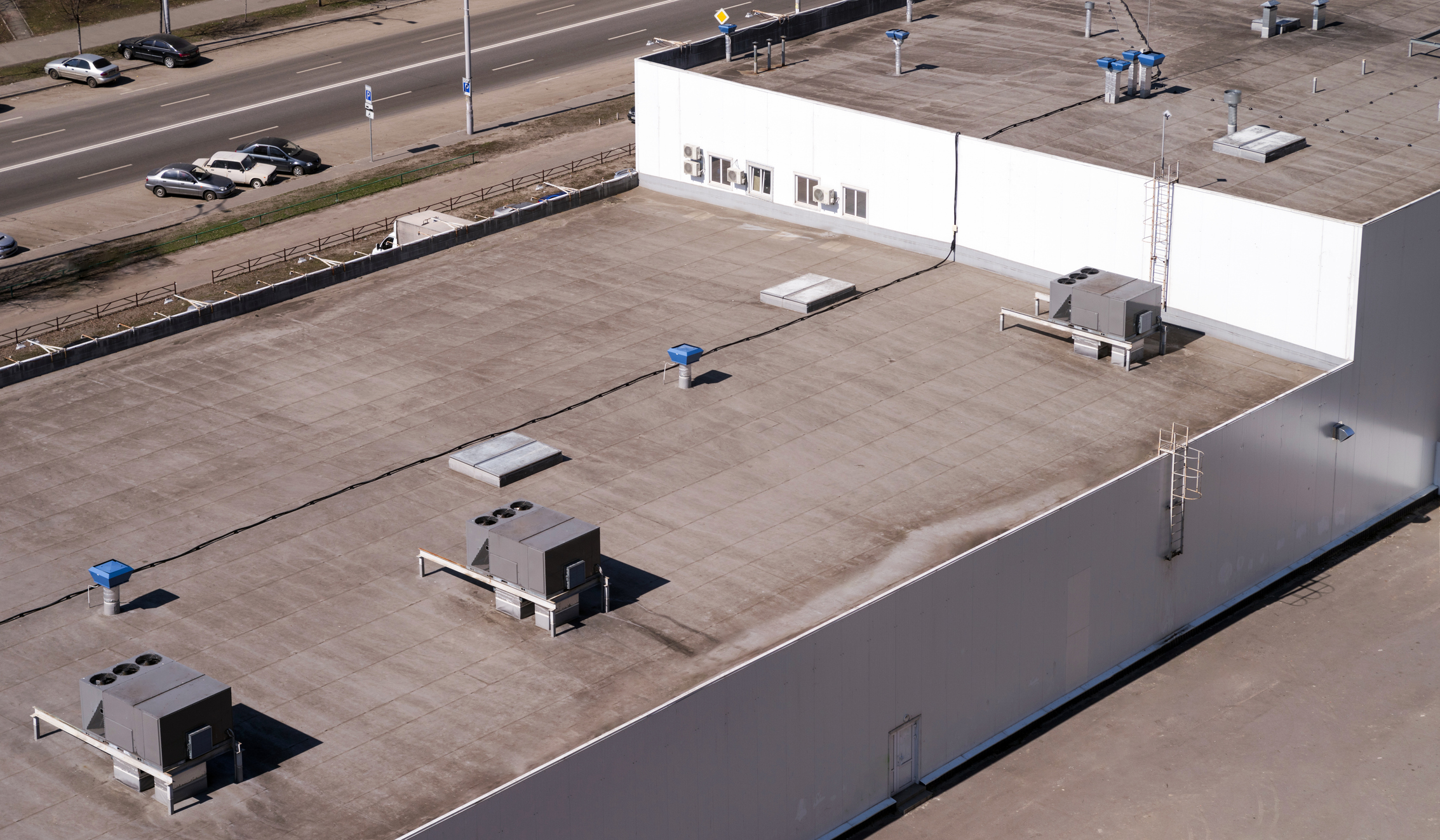 Aerial view of building rooftop with ventilation units